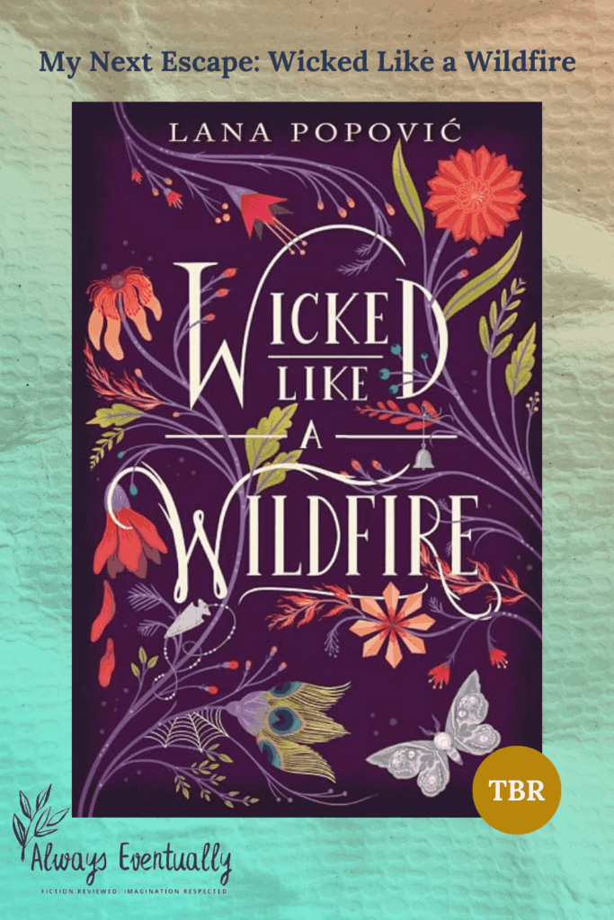 Purple book cover of Wicked Like a Wildfire with floral details in shades of red, gold, and sage green. The banner text reads “My Next Escape: Wicked Like a Wildfire,” evoking a magical and mysterious reading vibe.