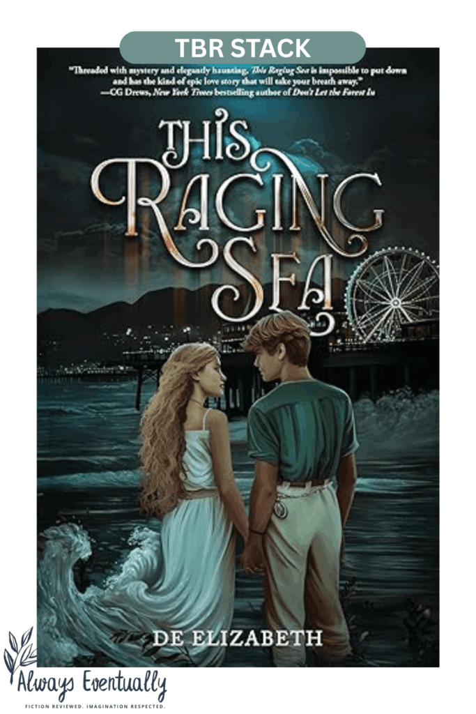 Book cover of This Raging Sea by De Elizabeth, featuring a young couple holding hands by the ocean with a pier and ferris wheel in the background. A YA dark fantasy coastal mystery with elements of paranormal suspense and romance.